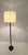 Sleek sophisticated Danish Modern mid-century ebonized wood and teak floor lamp with iron base.