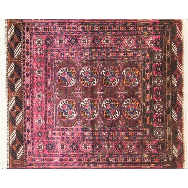 This handsome antique Turkoman rug displays a classic tribal composition featuring eight well-drawn elephant-foot guls...