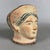 A striking decorative terracotta artifact with archaeological appeal, a classically styled reproduction attributed to...