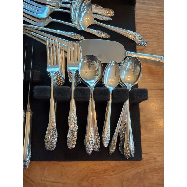 Vintage Oneida Community silverplate flatware set in the elegant 'Evening Star' pattern. This set features a classic...