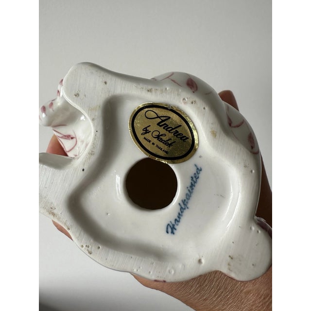 Add a charming touch of classic porcelain artistry to your collection with this Bunny Rabbit Figurine by Andrea by Sadek....