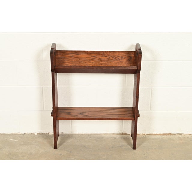 A gorgeous antique Mission or Arts & Crafts period oak bookcase, book trough, or magazine stand In the manner of Charles...