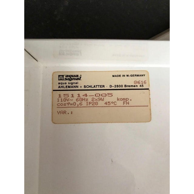 Set of four vintage modernist sconces designed by Aqua Signal, Germany, circa 1960s. Each sconce features a textured amber...