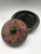 A finely engraved Burmese lacquer covered dish, likely a lahpet-ok, traditionally used to present fermented tea leaves and...