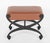 Handsome pair of Regency style steel stools with X-form bases. The steel with a blackened textured finish. Upholstered in...