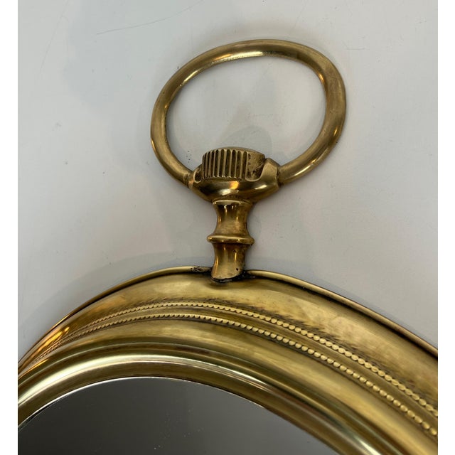 Metal Large brass mirror representing a pocket watch. French work. Circa 1970 For Sale - Image 7 of 9