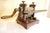 Candy machine with two bronze rollers and a cast iron frame. Monogram engraved "MSF" on the lower roller. Made by Robbi...