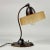 This Art Deco table lamp was designed any manufactured in Sweden in the 1920s to 1930s. The light features a gracefully...