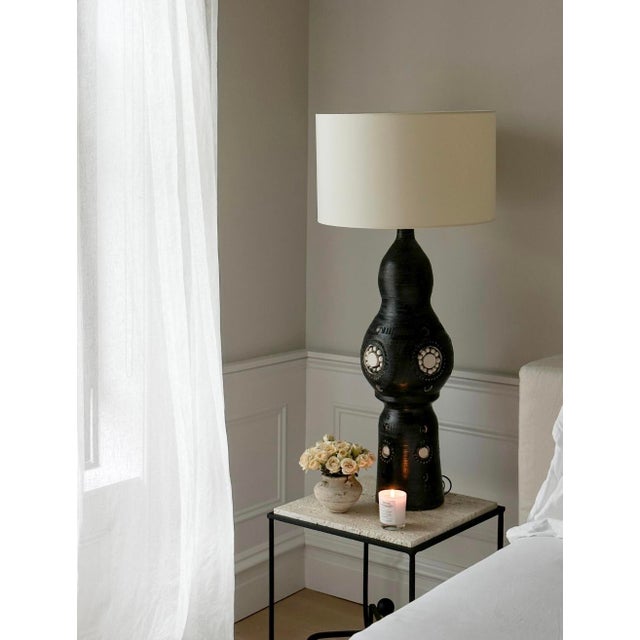 The overall scale of these iconic ceramic Lamps by Georges Pelletier command your attention and become a statement to any...