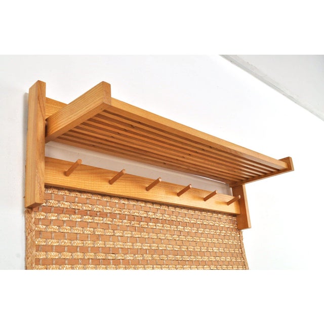 A unique oak wall coat rack with 6 hooks, a hat shelf, a separate shoe rack, and of course, rattan! made in the 1960s....