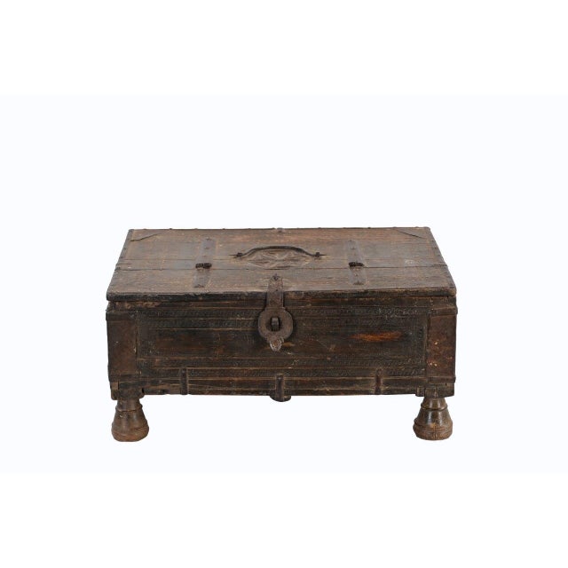 This Vintage Indian Teakwood Small Box is handcrafted from solid teakwood, elevated on turned bun feet. Featuring its...