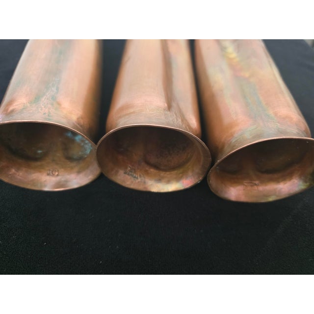 Vintage set of three graduated pillar style candle holders created in copper in the 'Brutalist' style by American...