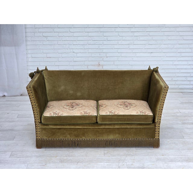 1970s, Danish 2-seater "Spanish" drop arm sofa. Original green furniture velour, springs in the seat cushions. Original...