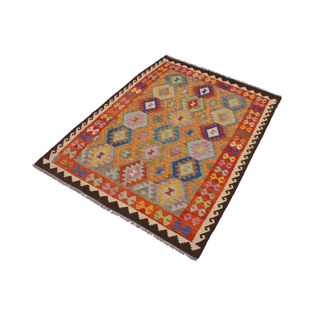 Add a touch of elegance to your home with this casual chic hand woven Tribal Kilim wool rug. Constructed on a loom by...