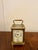 A charming antique Victorian miniature brass carriage clock with alarm, housed in a traditional gilt brass case with...