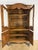Antique 1840'sornately carved oak French bookcase, featuring two glass-paneled upper doors and two solid lower doors....