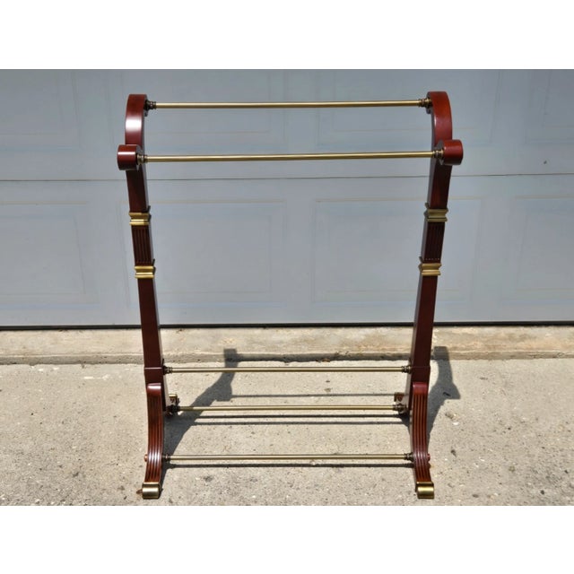 Ornate brass trim and feet on this Mahogany rack by Bombay, original stickers remain on the bottom. Remains in very good...