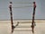 Ornate brass trim and feet on this Mahogany rack by Bombay, original stickers remain on the bottom. Remains in very good...