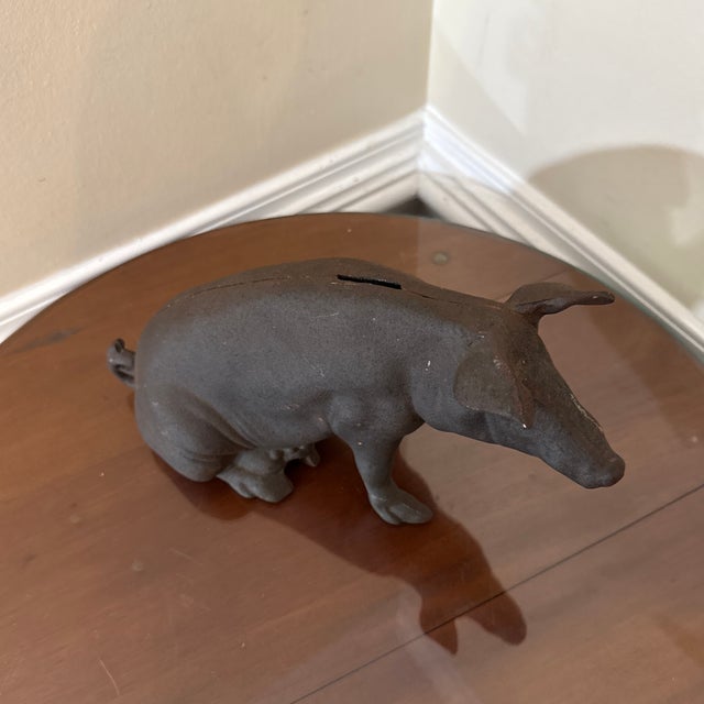 This vintage cast iron piggy bank is a great addition to any collection. Use this adorable fellow as a piggy bank or as a...