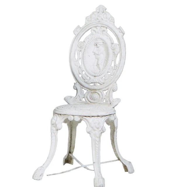 Antique Style Cast Aluminum chair with quadruped base with paw feet; and medallion back side chairs, the canted back with...