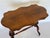 A finely carved stretcher base table with shaped rosewood top. American late 19th century.