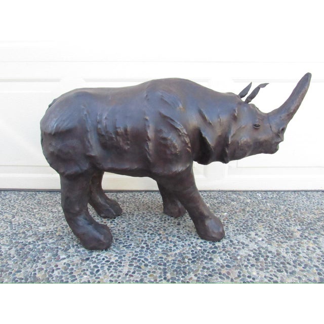 Vintage leather clad rhino, c.1980’s A fun rhino figurine with a well detailed chunky body and protruding horn. Floppy...