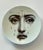 Vintage Piero Fornasetti "Tema e Variazioni" porcelain plate depicting the crying face of the famous opera singer Lina...