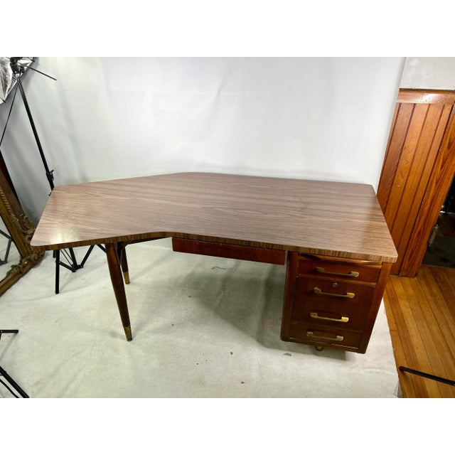 For sale is this very unique large Executive Boomerang Desk. The top is made out of laminate and the bottom is solid wood.
