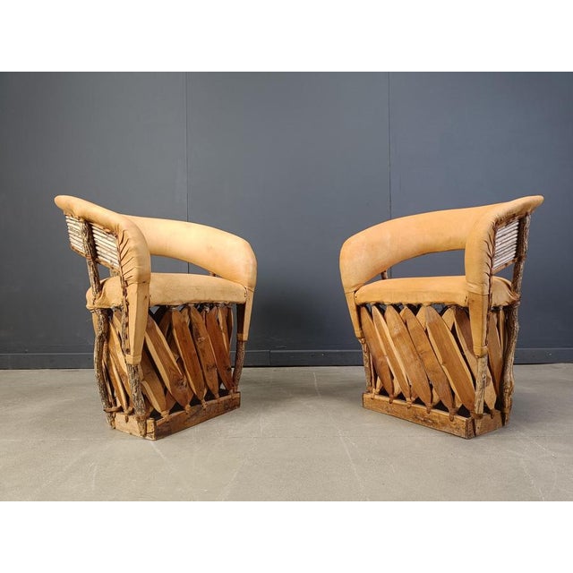 Remarkable art populaire or 'equipale' dining chairs from mexico. Exotic weaved wooden frames upholstered with ostrich...