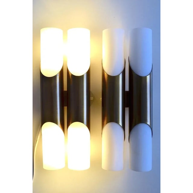 Wall lights set consisting of 2 wall lights with double tubes. The draft attributed Klaus Link for the Neuhaus company...