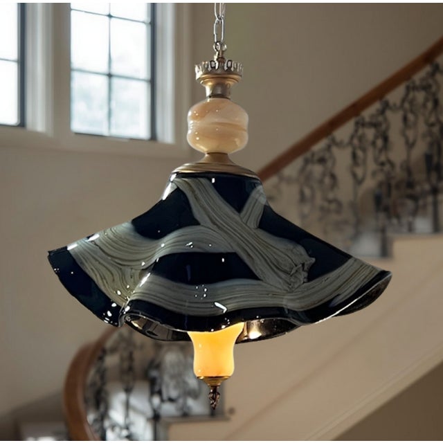 This striking, one-of-a-kind pendant lamp is a sculptural statement piece that seamlessly blends traditional European...