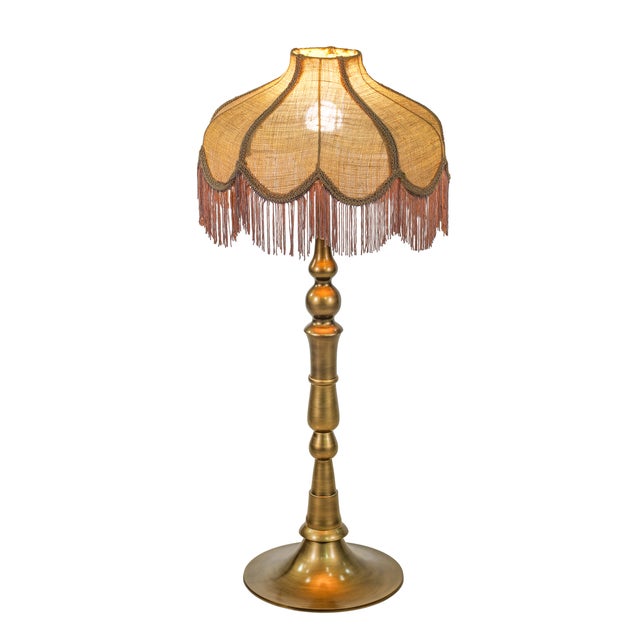 The Buchanan table lamp blends classic charm with modern flair. Its retro, old-world silhouette feels familiar and...