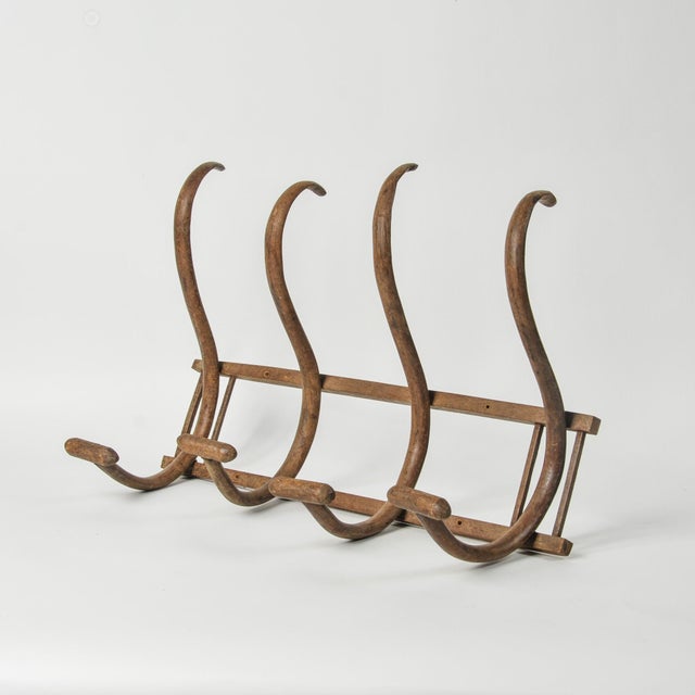 An incredible antique bentwood rack with four hooks, the real deal! The bentwood hooks are made by hand, each curve...