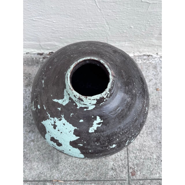 There's a whole story written on the surface of this vessel — and it didn't need words to tell it. A traditional Mexican...