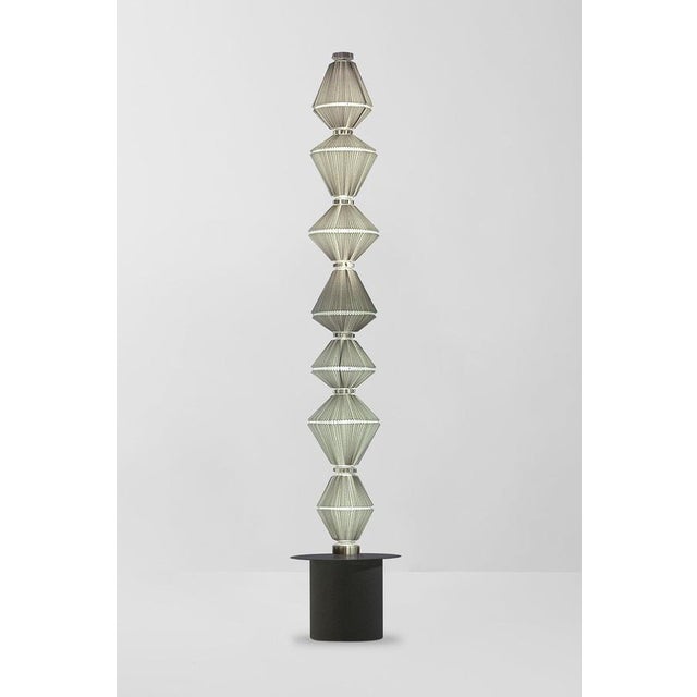 Oiphorique p gr floor lamp designed by atelier oi in 2014. manufactured by parachilna (spain) oïphorique displays an...