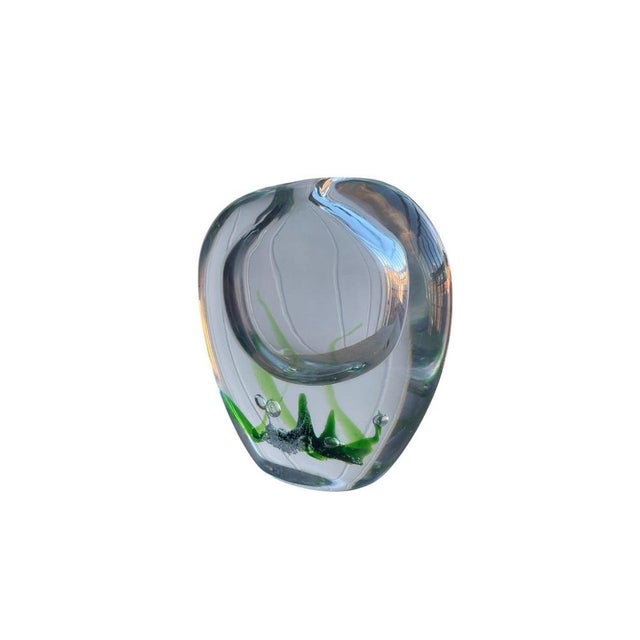 Elegant hand-blown glass vase from the sought-after “Seaweed” series, designed by legendary Swedish glass artist Vicke...