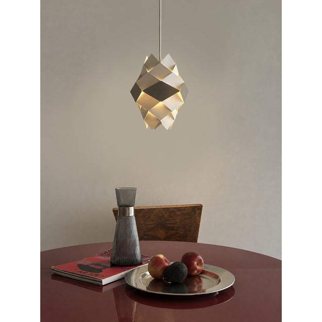 Few danish lamps play with light and shadow quite like the symfoni. Designed by the elusive preben dahl — sometimes called...