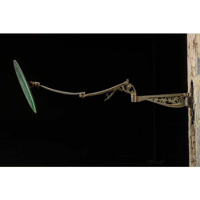 Late 19th-century adjustable wall-mounted bathroom or grooming mirror by Kato Manufacturing Co., featuring an articulated...