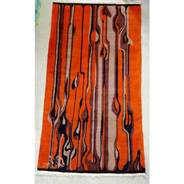 Artist carpet, signed and dated. Artists unknown. The carpet has smaller stains at one point and a small hole elsewhere....