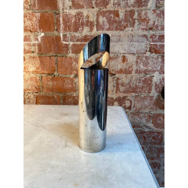 Beautiful and stunning flower holder made in silver , the flower holder has a very unique shape and is made in Italy 1970s