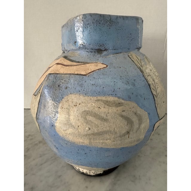 Very cool studio handmade vase in beautiful shade of blue decorated with nudes. Artist's signature at base. A great look.