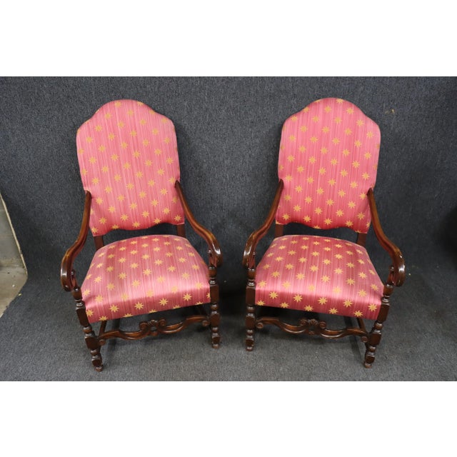 A pair of Jacobean Style high back Throne Chairs , solid walnut frame , scrolling arms ,turned legs with carved stretcher...