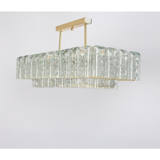 Fantastic two-tier midcentury chandelier by doria, germany, manufactured circa 1960-1969. 2 rings of murano glass...