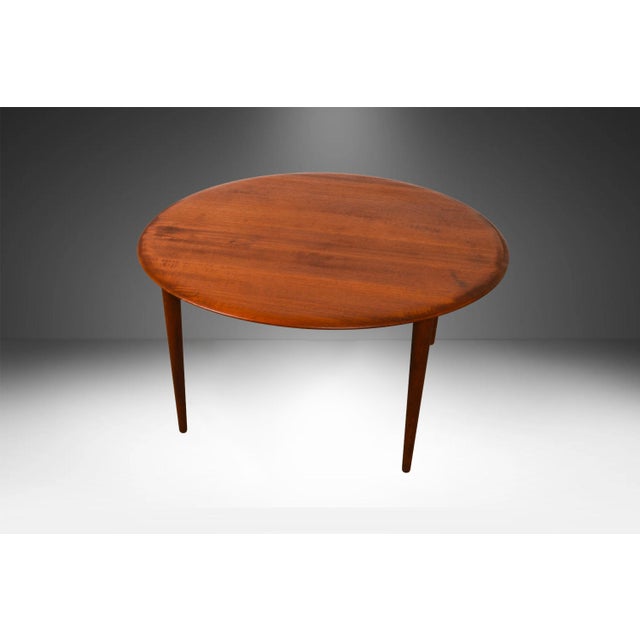 A beautiful Mid Century Modern round coffee table by Peter Hvidt & Orla Molgaard-Nielsen and produced by France & Son...