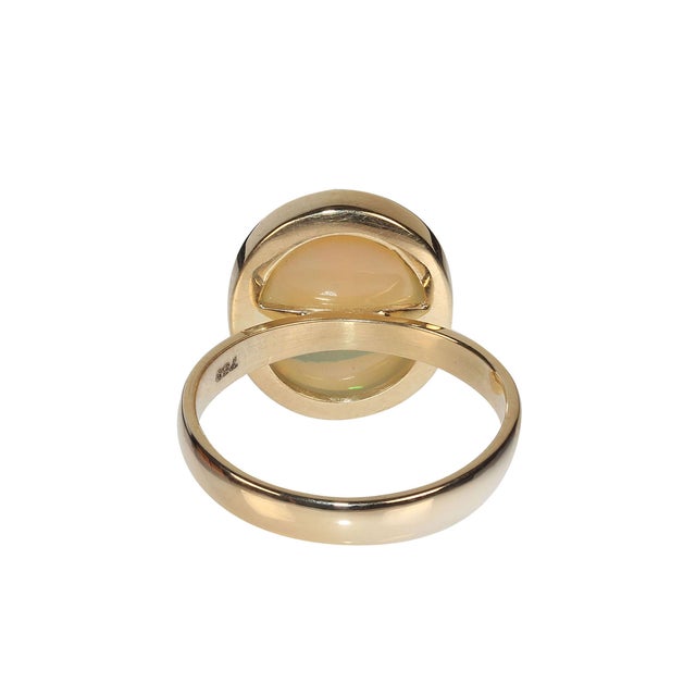 This is part of Chairish’s Fine Jewelry assortment. Creamy round opal with flashes of green and blue set in a handmade...