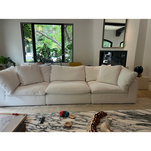 An authentic RH Cloud Modular Track Arm 8 Piece U Sectional. This sectional features a premium feather and down blend...
