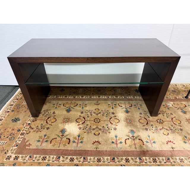Design Plus Gallery presents the Metro Media Console with Tempered Glass Shelf from Indo Puri. The console has...