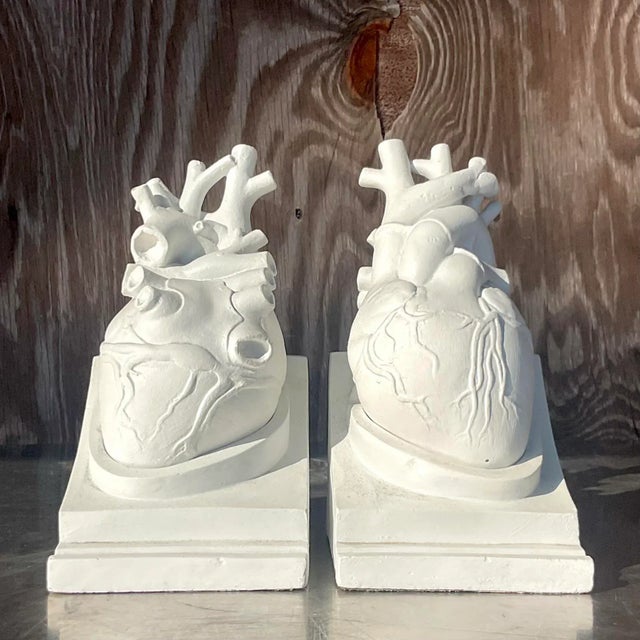An exceptional vintage pair of Boho plaster bookends. Amazing realistic hearts that rest in a plinth. Tagged Goldman and...