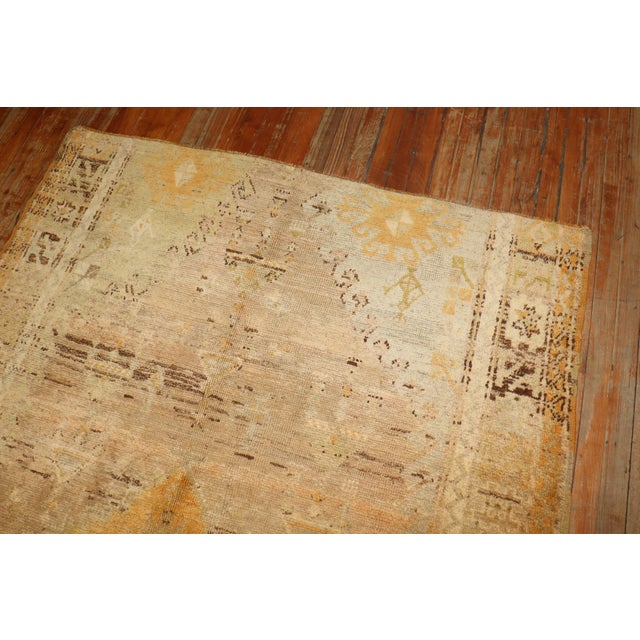 Breathtaking antique Turkish Oushak featuring warm gold tones. Hints of brown and green can be found too. Top end border...