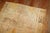 Breathtaking antique Turkish Oushak featuring warm gold tones. Hints of brown and green can be found too. Top end border...